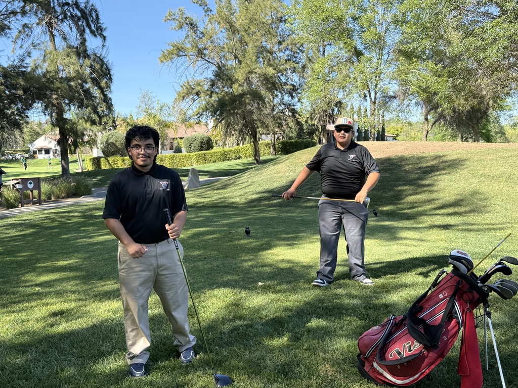 Elijah and Juan waiting to tee off