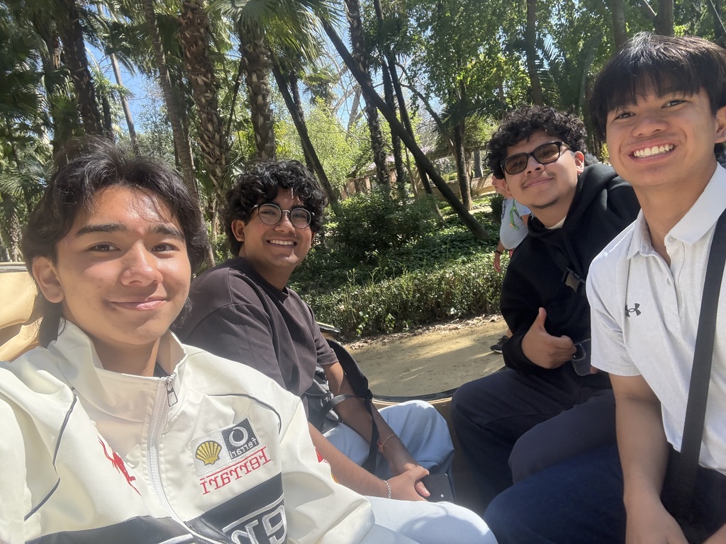 MUN Students Remy, Rahul, Peyton, and Luis riding a horse carriage