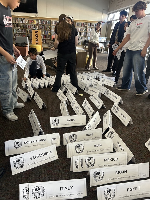 MUN students cleaning and organizing after conference!