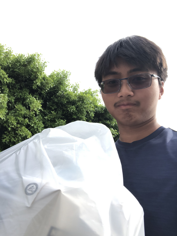 This is me carrying bottles to a recycling plant for our capstone project.