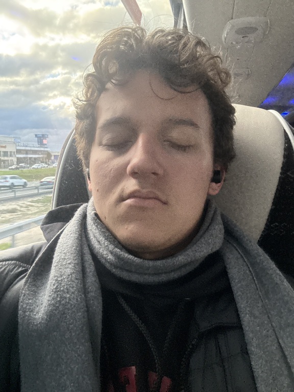 MUN Student Noah Martinez sleeping on a bus in Spain