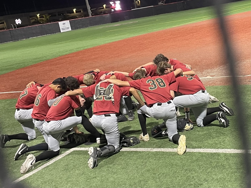 Remembering to pause post game to come together for team prayer.