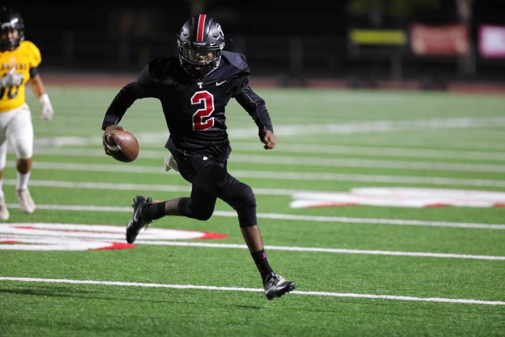 QB escapes the pocket and gets the first down!