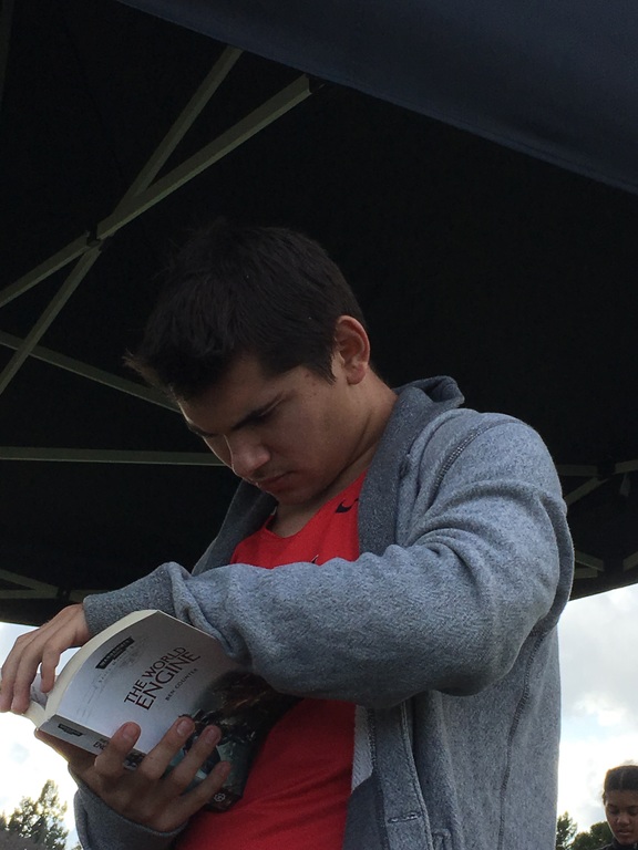 Troy always finding time to read and be beautiful