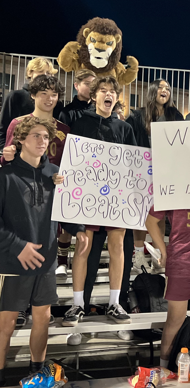 JV Team and our lion cheering on the Varsity